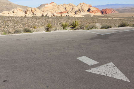 Directional arrow on the empty parking lot in Mojave Desert, Nevada.の写真素材