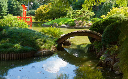 Japanese Garden and pond with a red Zen Tower の写真素材