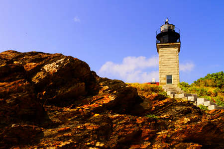 Lighthouse on a rocky shoreの写真素材