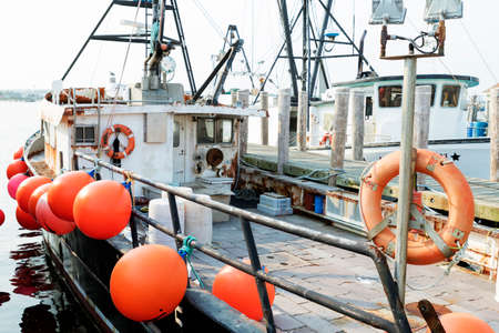 Detail of commercial fishing boat equipment at the dock.の写真素材