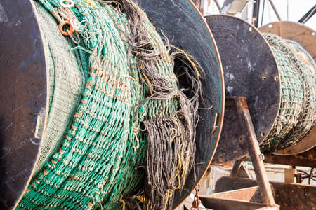 Detail of commercial fishing boat equipment at the dock.の写真素材
