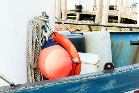 Detail of commercial fishing boat equipment at the dock.の写真素材
