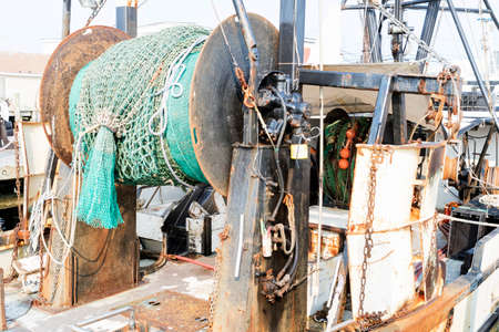 Detail of commercial fishing boat equipment at the dock.