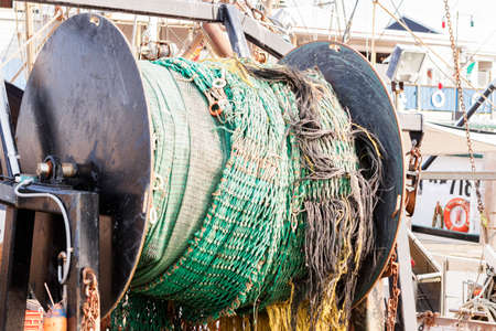 Detail of commercial fishing boat equipment at the dock.の写真素材