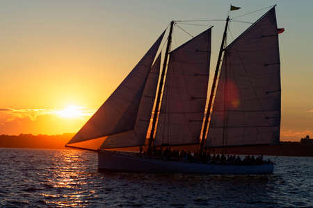 Sail boat at sunset on the ocean.の写真素材