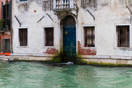 Venice, Italy - April 1, 2013: Street views of canals and ancient architecture in Venice, Italy. Venice is a city in northeastern Italy sited on a group of 118 small islands separated by canals and linked by bridges.のeditorial素材