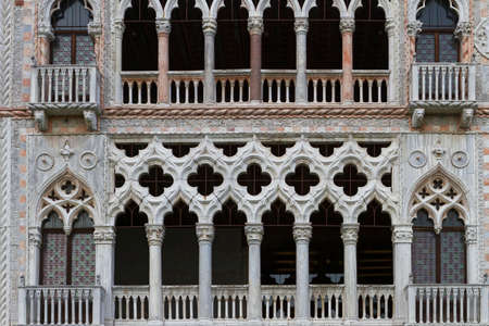 Venice, Italy - April 1, 2013: Street views of canals and ancient architecture in Venice, Italy. Venice is a city in northeastern Italy sited on a group of 118 small islands separated by canals and linked by bridges.のeditorial素材