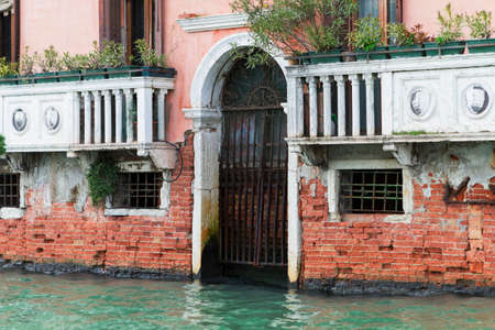 Venice, Italy - April 1, 2013: Street views of canals and ancient architecture in Venice, Italy. Venice is a city in northeastern Italy sited on a group of 118 small islands separated by canals and linked by bridges.のeditorial素材