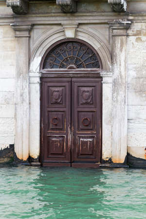 Venice, Italy - April 1, 2013: Street views of canals and ancient architecture in Venice, Italy. Venice is a city in northeastern Italy sited on a group of 118 small islands separated by canals and linked by bridges.のeditorial素材