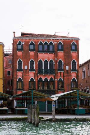 Venice, Italy - April 1, 2013: Street views of canals and ancient architecture in Venice, Italy. Venice is a city in northeastern Italy sited on a group of 118 small islands separated by canals and linked by bridges.のeditorial素材