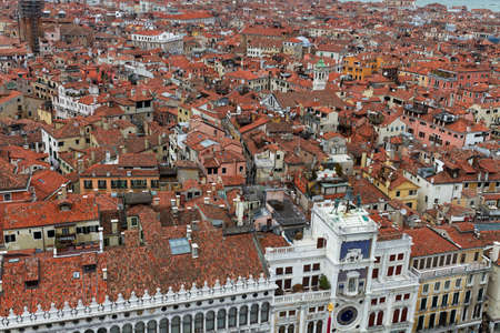 Rooftop views of canals and ancient architecture in Venice, Italy. Venice is a city in northeastern Italy sited on a group of 118 small islands separated by canals and linked by bridges.のeditorial素材