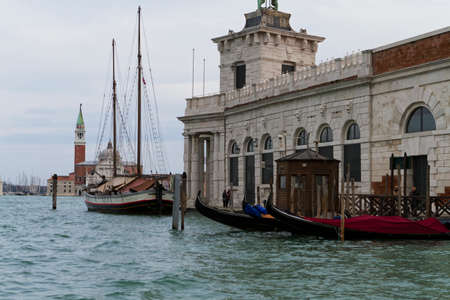 Venice, Italy - April 1, 2013: Street views of canals and ancient architecture in Venice, Italy. Venice is a city in northeastern Italy sited on a group of 118 small islands separated by canals and linked by bridges.のeditorial素材
