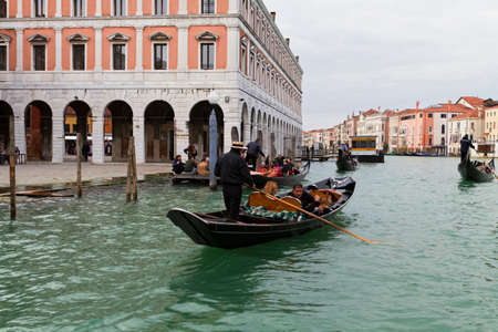 Venice, Italy - April 1, 2013: Street views of canals and ancient architecture in Venice, Italy. Venice is a city in northeastern Italy sited on a group of 118 small islands separated by canals and linked by bridges.のeditorial素材