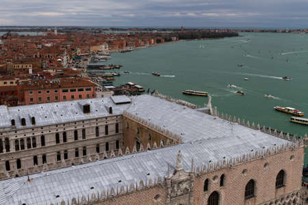 Rooftop views of canals and ancient architecture in Venice, Italy. Venice is a city in northeastern Italy sited on a group of 118 small islands separated by canals and linked by bridges.のeditorial素材