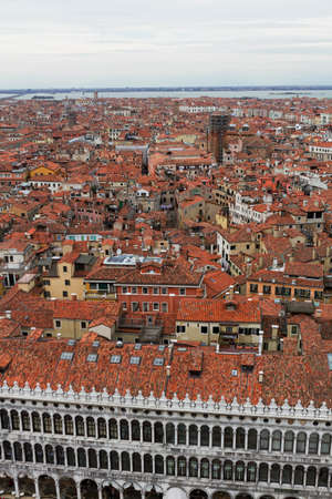 Rooftop views of canals and ancient architecture in Venice, Italy. Venice is a city in northeastern Italy sited on a group of 118 small islands separated by canals and linked by bridges.のeditorial素材