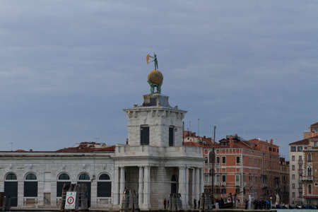 Venice, Italy - April 1, 2013: Street views of canals and ancient architecture in Venice, Italy. Venice is a city in northeastern Italy sited on a group of 118 small islands separated by canals and linked by bridges.のeditorial素材