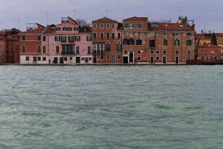 Venice, Italy - April 1, 2013: Street views of canals and ancient architecture in Venice, Italy. Venice is a city in northeastern Italy sited on a group of 118 small islands separated by canals and linked by bridges.のeditorial素材