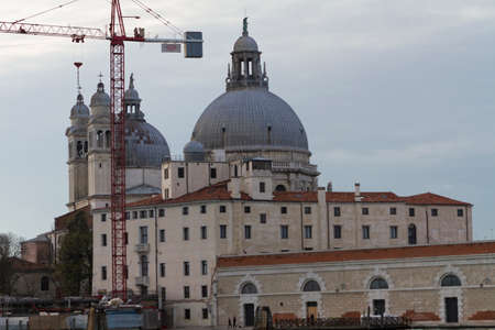 Venice, Italy - April 1, 2013: Street views of canals and ancient architecture in Venice, Italy. Venice is a city in northeastern Italy sited on a group of 118 small islands separated by canals and linked by bridges.のeditorial素材