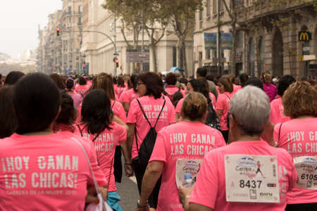 Barcelona, Spain- November 8, 2015: Participants of the annual Breast Cancer Awareness Run on the streets of Barcelona.のeditorial素材