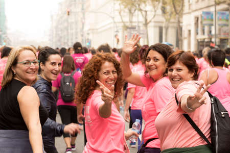 Barcelona, Spain- November 8, 2015: Participants of the annual Breast Cancer Awareness Run on the streets of Barcelona.のeditorial素材