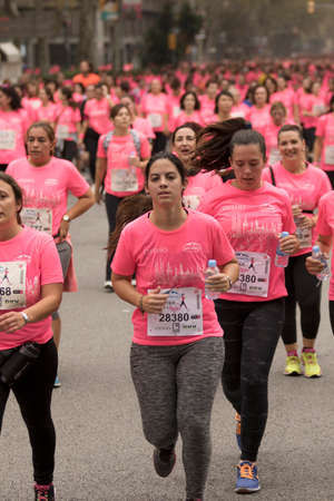 Barcelona, Spain- November 8, 2015: Participants of the annual Breast Cancer Awareness Run on the streets of Barcelona.のeditorial素材