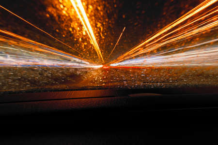 Long exposure speed car lights trails on a night highway.の写真素材