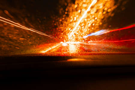 Long exposure speed car lights trails on a night highway.の写真素材