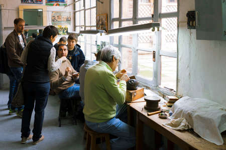 Toledo, Spain- November 04, 2015: Artisan jewelers creating hand made jewelry items in a workshop.のeditorial素材