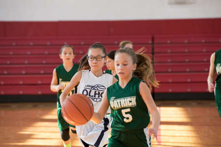 Staten Island, USA-December10,2016: Girl basketball OLHA team squares off with Team St.Patrick. Teams are sponsored by The Catholic Youth Organization of the Archdiocese of New York.のeditorial素材