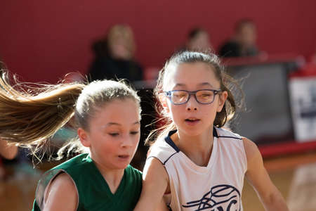 Staten Island, USA-December10,2016: Girl basketball OLHA team squares off with Team St.Patrick. Teams are sponsored by The Catholic Youth Organization of the Archdiocese of New York.のeditorial素材