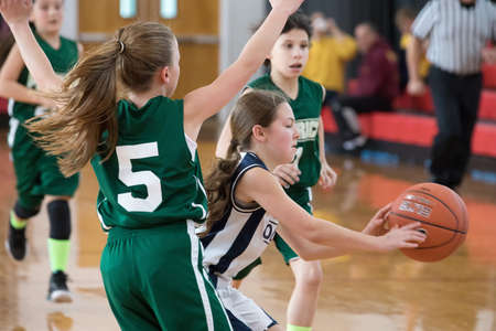 Staten Island, USA-December10,2016: Girl basketball OLHA team squares off with Team St.Patrick. Teams are sponsored by The Catholic Youth Organization of the Archdiocese of New York.のeditorial素材