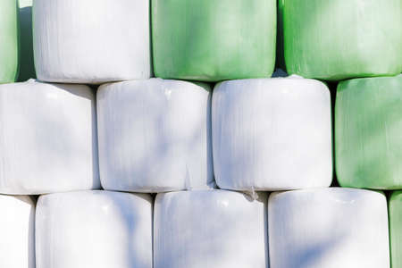 Hay bales stored on a farmland.の写真素材