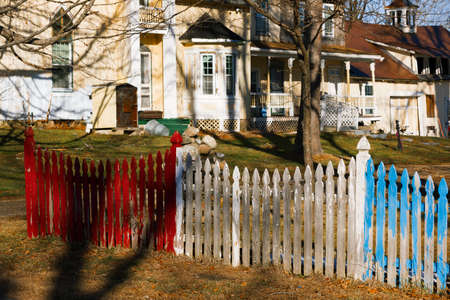 Colorful picket fence on a farmland.のeditorial素材