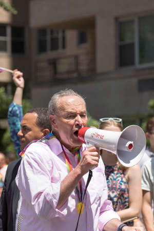 New York City, USA-June 25, 2017: U.S. Senator Charles Ellis âChuckâ Schumer participates in NYC Pride March. Gay Pride events occur throughout the month of June, culminating with the March along the 5th Avenue.のeditorial素材
