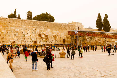 Jerusalem, Israel-March 14, 2017: Jews pray at The Western Wall - the holiest place where Jews are permitted to pray, though it is not the holiest site in the Jewish faith, which lies behind it, on Temple Mount.のeditorial素材