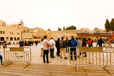 Jerusalem, Israel-March 14, 2017: Jews pray at The Western Wall - the holiest place where Jews are permitted to pray, though it is not the holiest site in the Jewish faith, which lies behind it, on Temple Mount.のeditorial素材