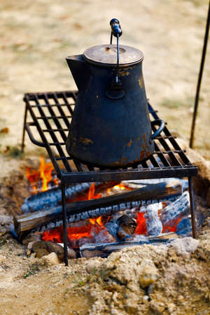 Ancient tea kettle on campfire.の写真素材