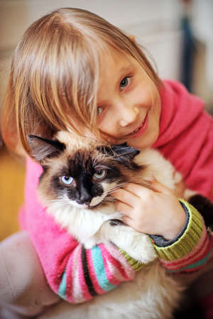 Plays a girl and with a cat in natureの写真素材