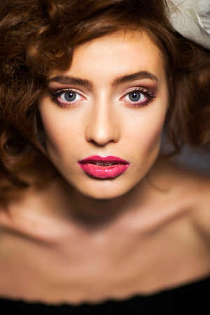 Portrait of a beautiful woman with healthy long brown hair and fresh makeup. Wavy Hair. Hairstyle....