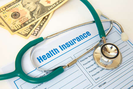 Health insurance with insurance claim form and stethoscope. Health insurance conceptの写真素材