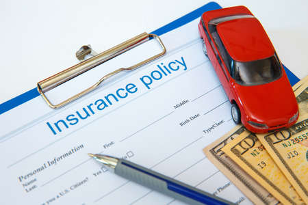 Insurance concept. Auto insurance policy and other documentsの写真素材