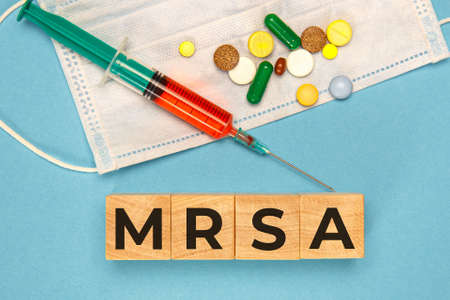 Wodden cubes with words MRSA Methicillin-resistant Staphylococcus Aureus. Medical conceptの写真素材