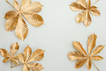 Gold leaf design elements around the edge of the frame. Frame of golden leaves.