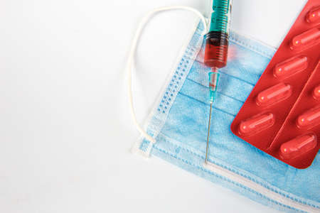 The inscription medical protective mask. Syringe and pills. Coronovirusの写真素材