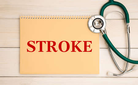 Card with text Stroke and stethoscope, medical concept.の写真素材