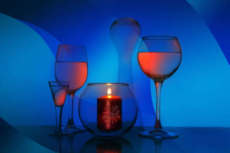 Glass fantasy with glasses and a candle. Glass still lifeの写真素材