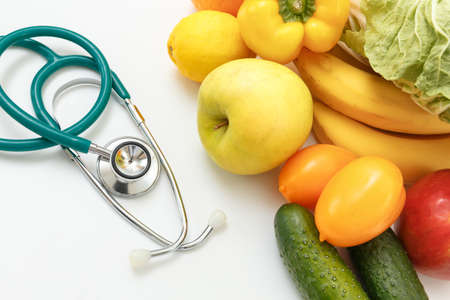 Nutrition and healthy eating. Fruits, vegetables, juice and stethoscope
