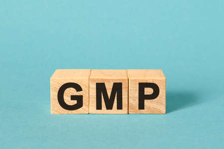 GMP Good Manufacturing Practice - inscription on wooden cubesの写真素材