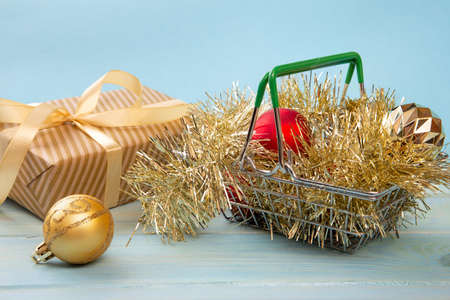 Shopping basket with New Year gifts. Holiday shopping concept.の写真素材