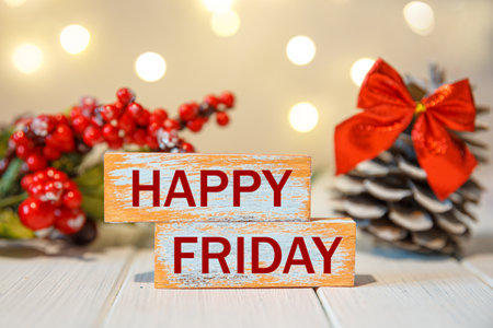 Happy Friday word is written on woodblock. Happy Friday text on the table of lightsの写真素材
